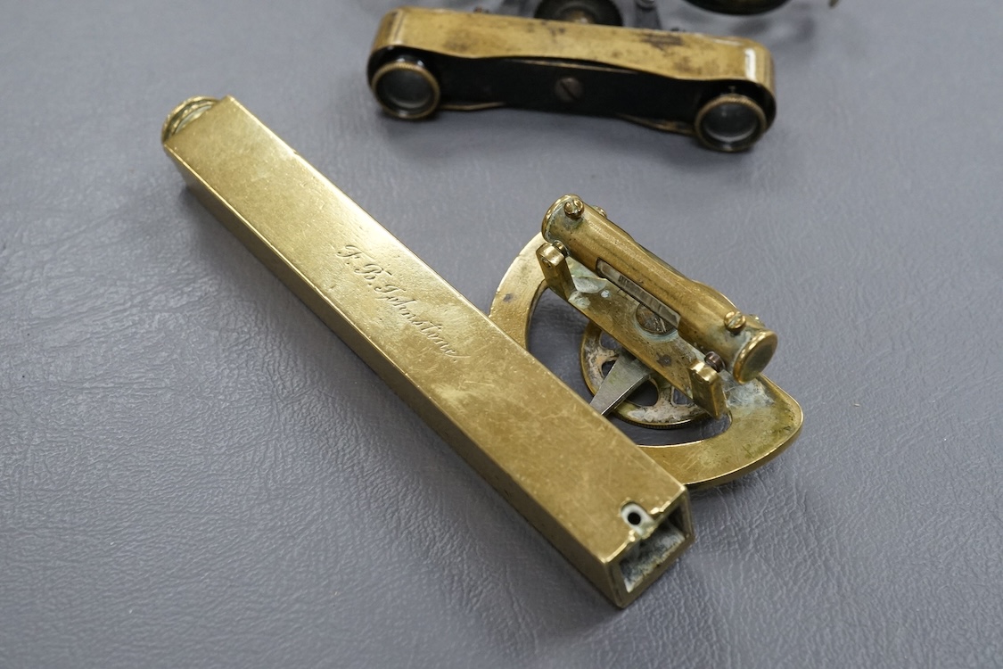 A brass Abney’s level by Elliott, London, 12cm long, together with a pair of folding brass miniature binoculars, 10cm wide.